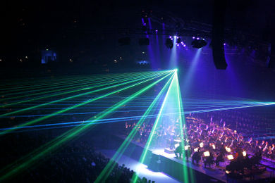 Dark lighting in a concert hall allow laser effects to be visible